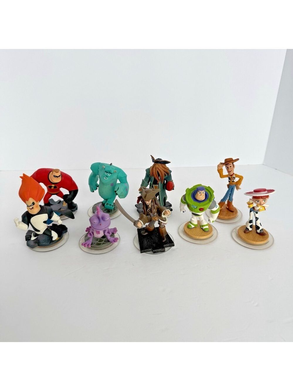 Disney Infinity Figures Lot of 9 Toy Story Pirates Monsters Inc Incredibles VGUC